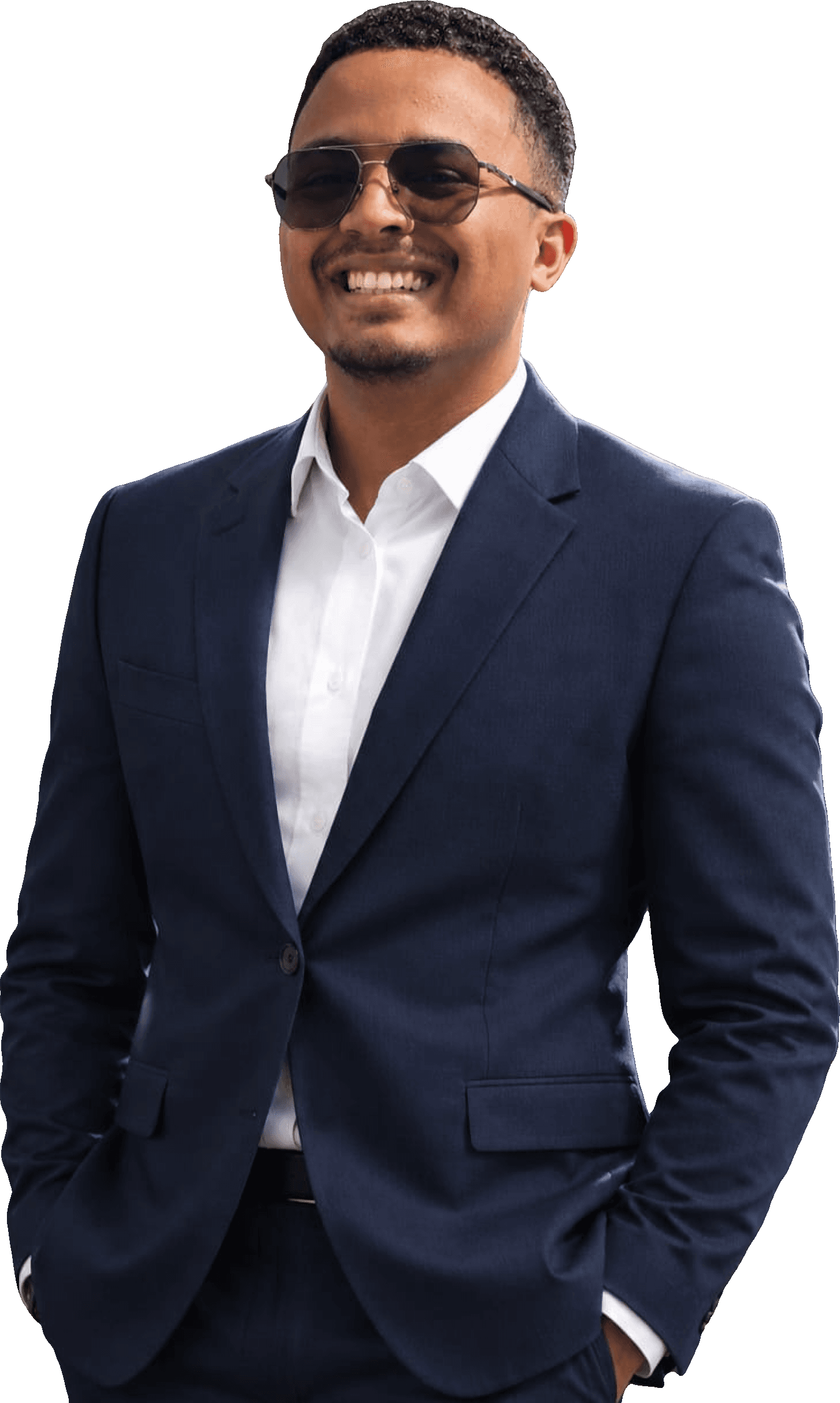 Christy Jedidiah Rabemiarintsoa smiling in a navy suit and sunglasses, hands in pockets